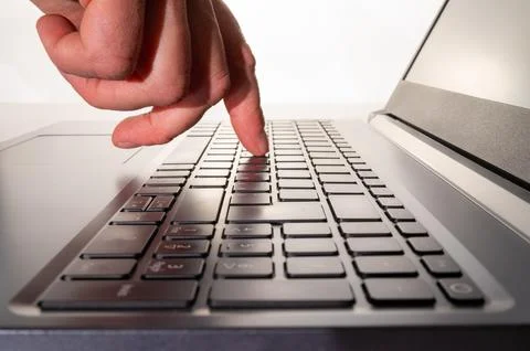 Hand on PC keyboard. Stock Photos