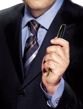 Hand with pen Stock Photos