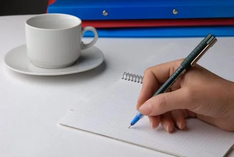 Hand with a pen Stock Photos