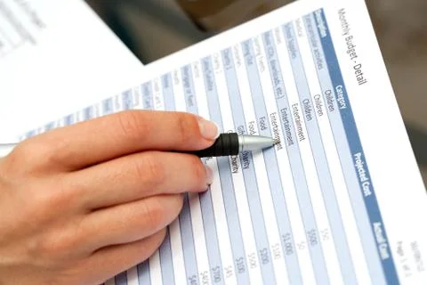 Hand with pen pointing on financial document. Foto stock