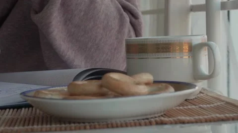 Hand with pen writing text in notebook. Girl writing in comfortable atmosphere. Stock Footage 130390099