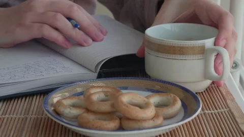 Hand with pen writing text in notebook. Portrait of girl writing in comfortable Stock Footage 130390129