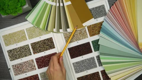 Hand with pencil shows on combination of different colors. Designer table Stock-Footage 219718902