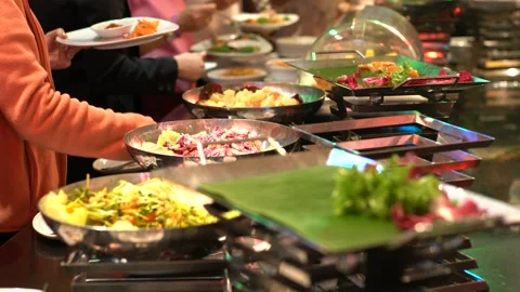 Hand of people group in catering buffet food indoor luxury hotel restaurant Stock Footage 149368236