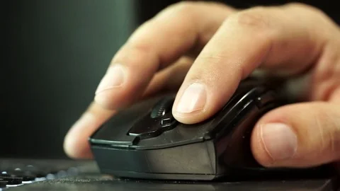 The hand of the person clicks with a computer mouse Видео 74305608