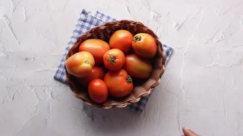 Hand Of Person Picking Tomatoes from a Bowl Stock Footage 225077448