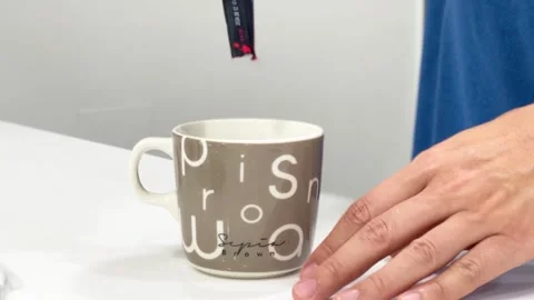 Hand of a person preparing an easy-to-package instant coffee Stock Footage 267697984