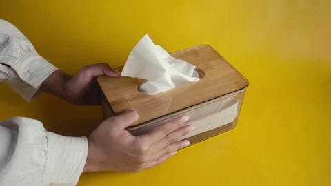 Hand Person Put Tissue Box with Isolated Yellow Background Stock Footage 269125164