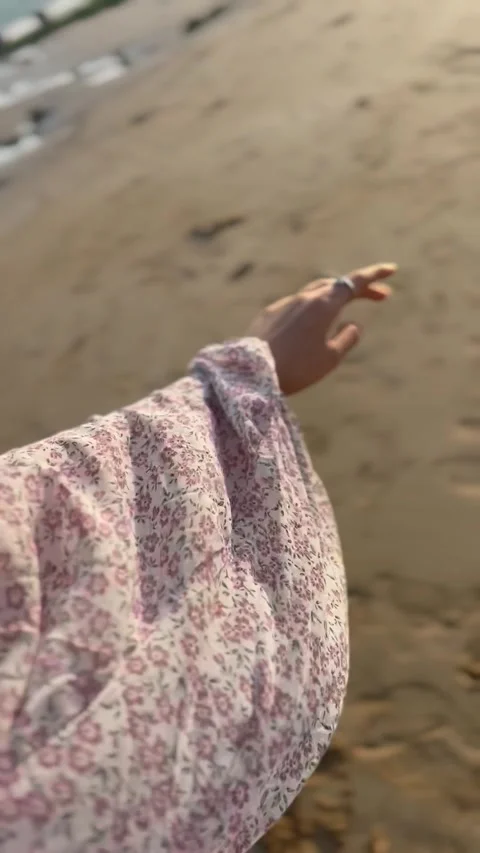 Hand of a person reaching out in the wind on a beach, POV shot, Vídeos de archivo 336849468