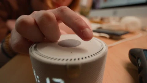 Hand of Person Tapping Button on Smart Speaker for Home Automation Stock Footage 340805310