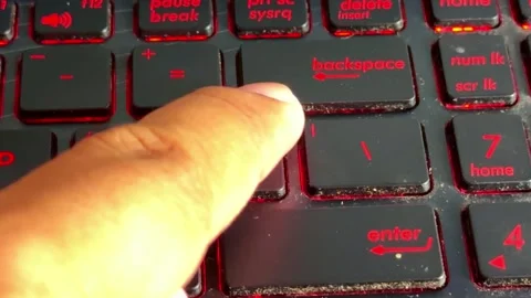 Hand of person typing on "]" keyboard, finger press action, digital workspace, Stock Footage 333940499