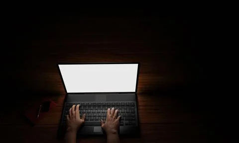 The hand of a person using a notebook or laptop, a blank screen, white, dark  イラスト素材