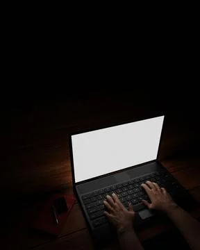 The hand of a person using a notebook or laptop, a blank screen, white, dark  Illustrazione stock