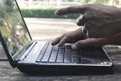Hand Person working pointing to screen and using on a laptop computer for f.. Stock Photos