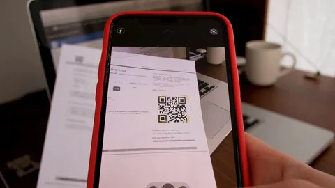 Hand with phone scans QR Code Stock Footage 128425812