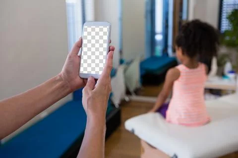 Hand of physiotherapist using mobile phone 스톡 사진