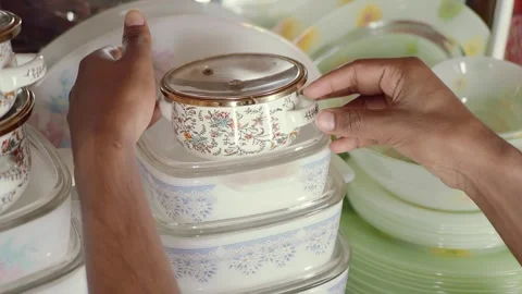 Hand pick kitchenware from a shelf. Stock Footage 345015674