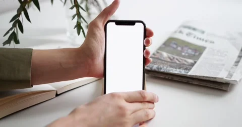 Hand pick up mobile with blank screen Stock Footage 238388824