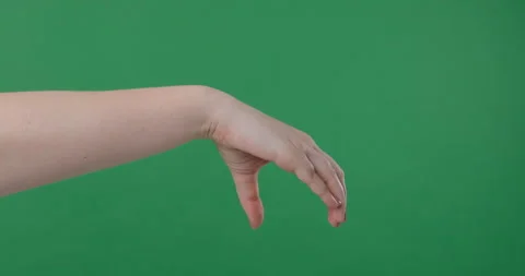 Hand pick up something big on green background Stock Footage 149675837