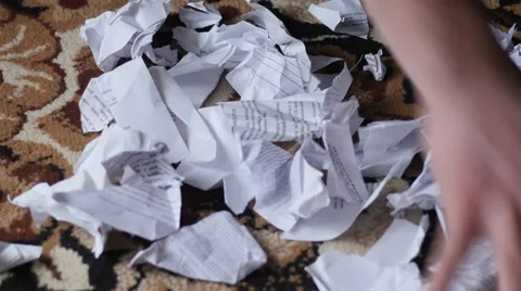 Hand pick torn and crushed documents from floor Stock Footage 48650483