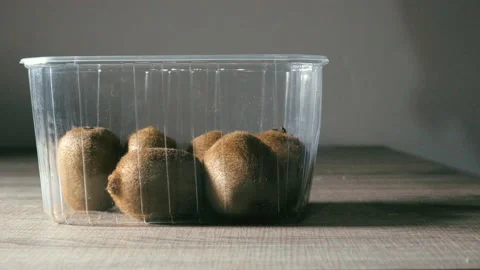 Hand picking the best kiwi Stock Footage 233211441