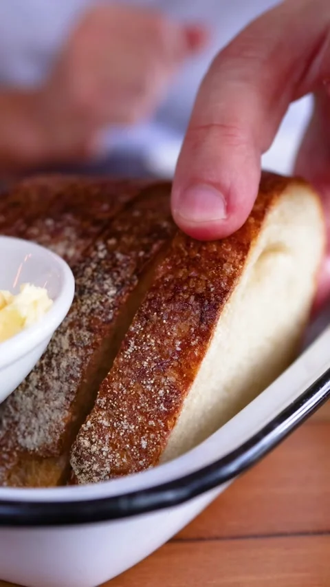 Hand Picking Bread Slice from Plate with Butter 스톡 동영상 307822149