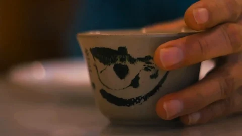Hand picking up Chinese tea cup Video stock 90522517
