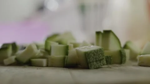 Hand Picking Chopped Zucchini With Knife During Fresh Food Preparation Close Up Stock Footage 336337059