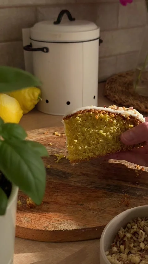 Hand picking up delicious slice of lemon cake Stock Footage 337194891