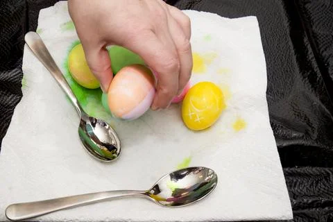 A hand picking an Easter Egg from a pile. Stock-Fotos