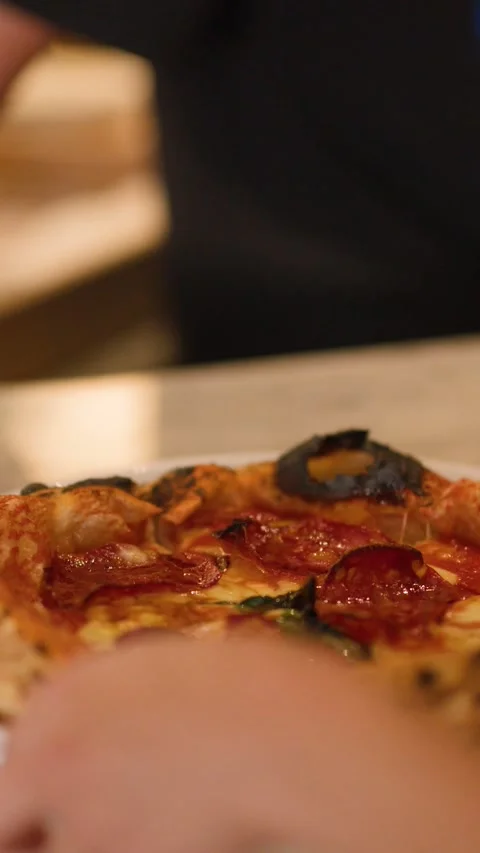 Hand Picking Up Fresh Neapolitan Pepperoni Pizza From Marble Table Stock Footage 337281192