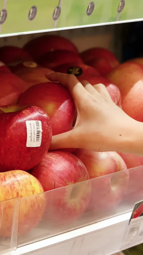 Hand Picking Fresh Red Apple From Supermarket Shelf Stock Footage 344527973