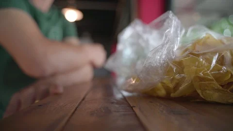 Hand picking fried crispy banana chip snack Video stock 117329769
