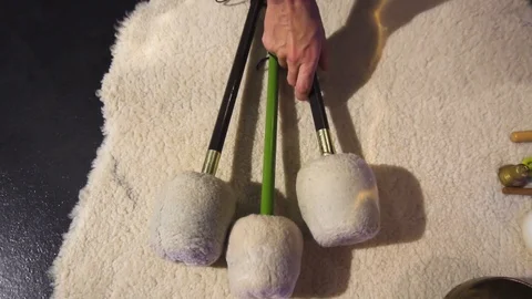 Hand picking a mallet for gong. Stock Footage 100292564