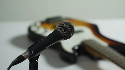 Hand picking up a microphone Stock Footage 99752499