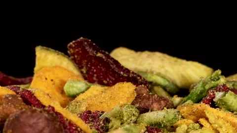 Hand Picking Mixed Dried Vegetable Chips Against Stock Footage 329544163