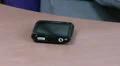 Hand picking up mobile on desk HD Footage