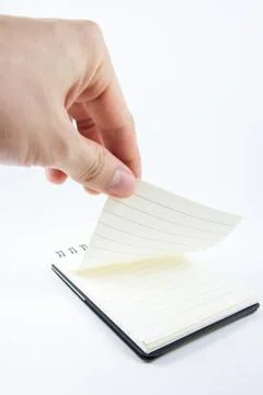 Hand picking notepad, notebook paper Stock-Fotos