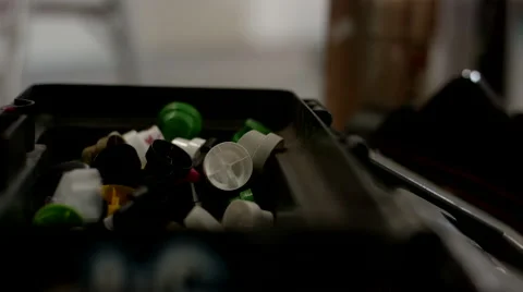 Hand picking up nozzle from container. Stock Footage 63431674