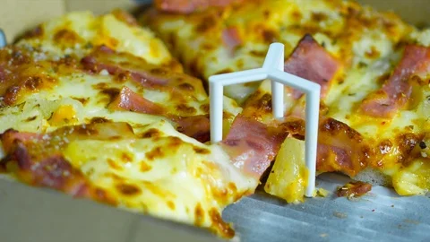 Hand picking the pizza Stock Footage 93604071