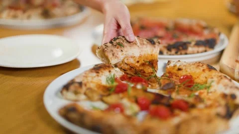 Hand Picking Up Slice of Fresh Margherita Pizza in Italian Restaurant Stock Footage 339401838