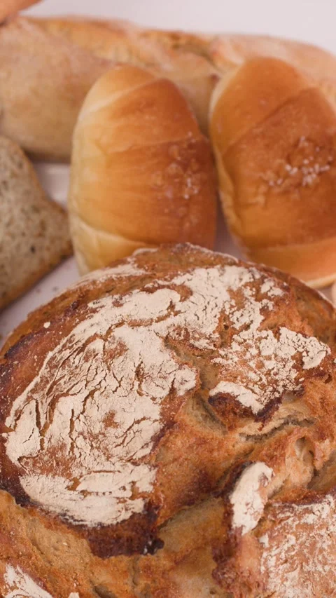 Hand Picking Sliced Multigrain Bread from Assorted Bakery Display Stock Footage 337860299