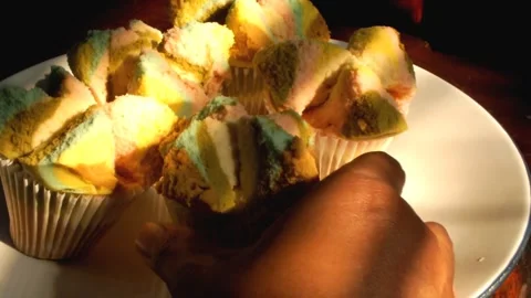 Hand picking up a steamed sponge cake Video stock 341682611