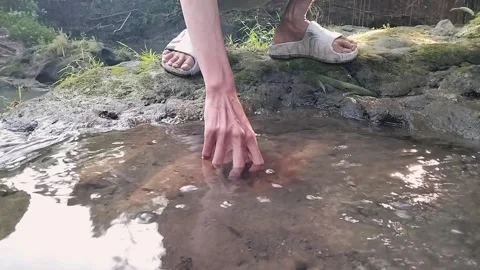 "Hand Picking a Stone from Clear Stream in Nature – 0.50x Slow Motion" Stock Footage 308427966