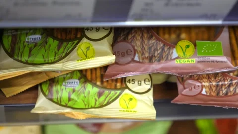 Hand picking vegan snack from the shelf. Healthy life style.2020-Warsaw-Poland Stock Footage