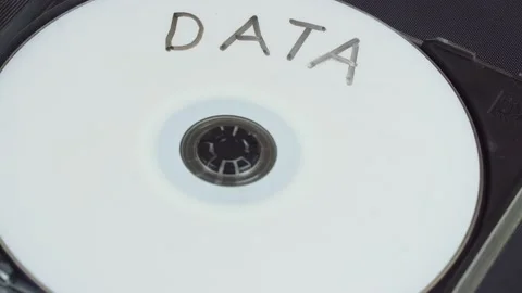 Hand picks up and installs a white CD DVD disc in a plastic box. Stock Footage 137591511