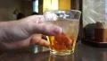 Hand Picks Up And Puts Down Glass Of Plum Wine With Ice At Tokyo Restaurant 4k or 4k+ Resolution