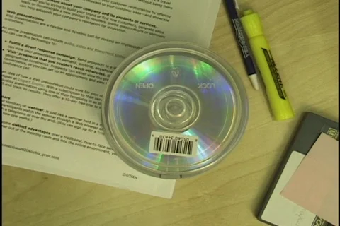 Hand Picks up CD Stock-Footage 297674