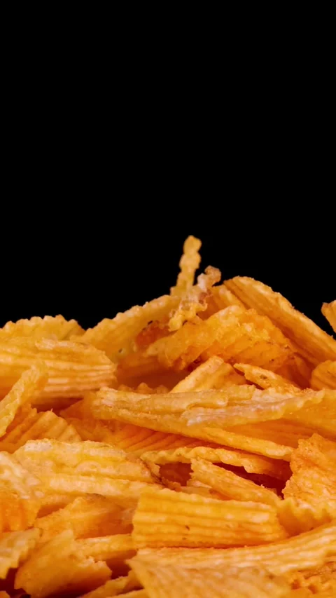 Hand Picks Up Crispy Potato Chip From Pile Against Black Stock Footage 323048813