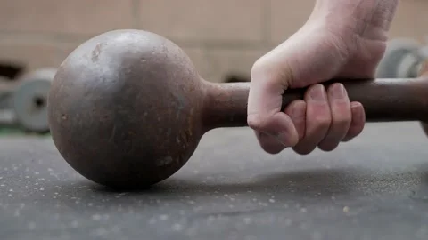 Hand picks up dumbbell close up Stock Footage 163767228